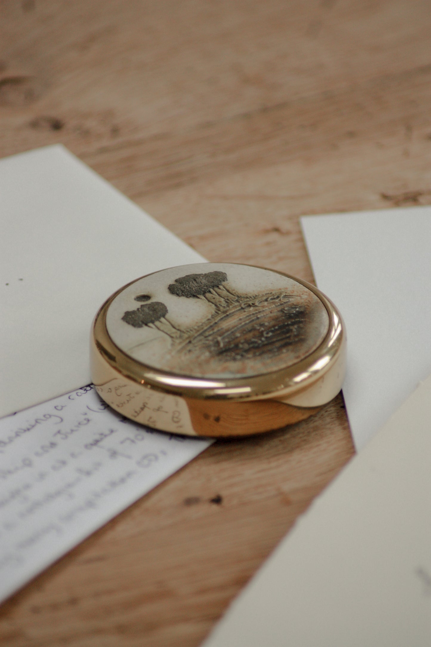 Vintage solid brass and pottery paperweight