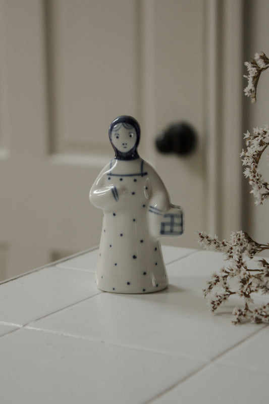 Vintage handpainted blue and white girl figurine