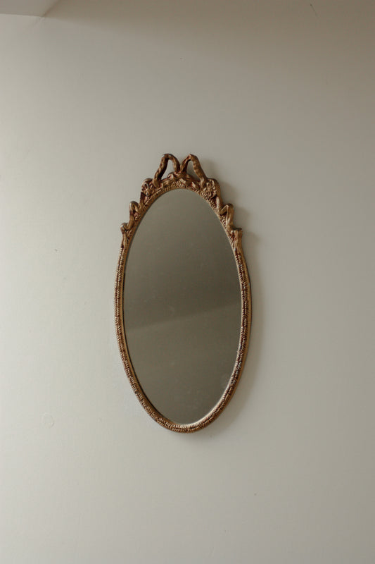 Vintage metal bow mirror