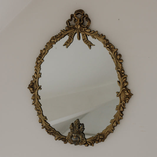 Vintage metal bow mirror