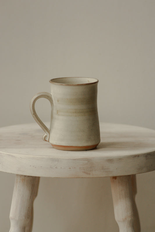 Vintage studio pottery mug with muted green stripe