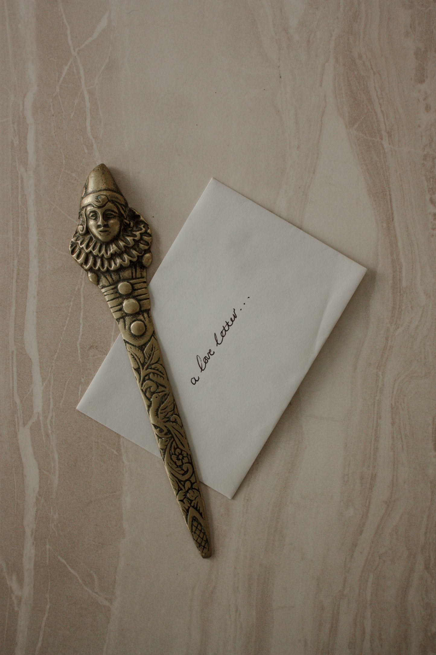 Vintage brass clown letter opener