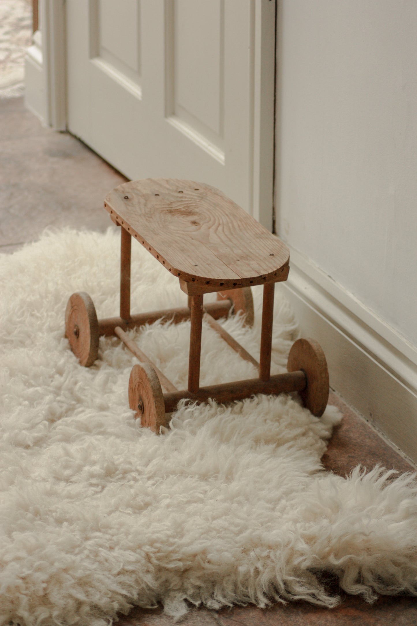 Vintage scratch built wooden riser on wheels