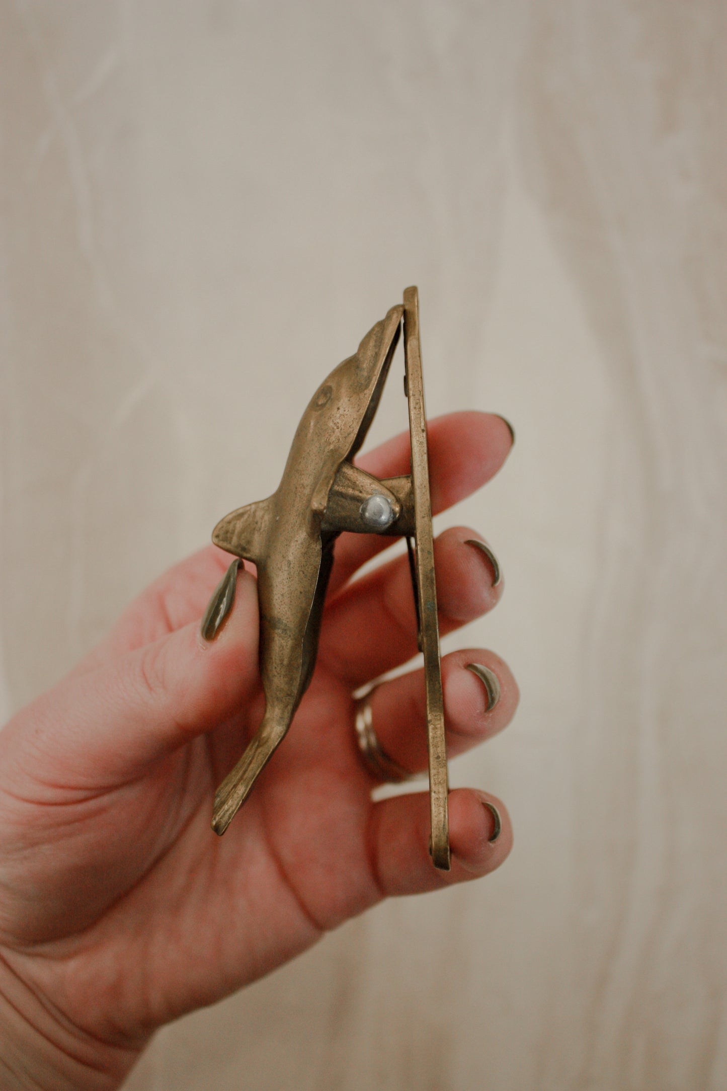 Vintage brass dolphin letter clip / bottle opener