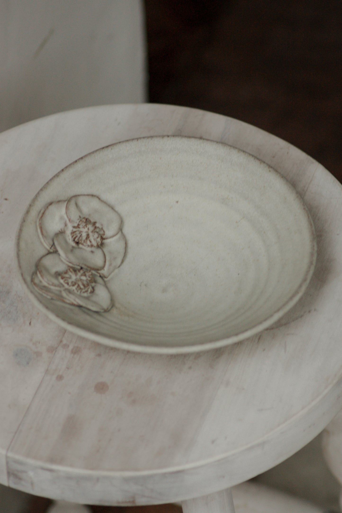 Rustic studio pottery bowl with rustic glaze and floral details