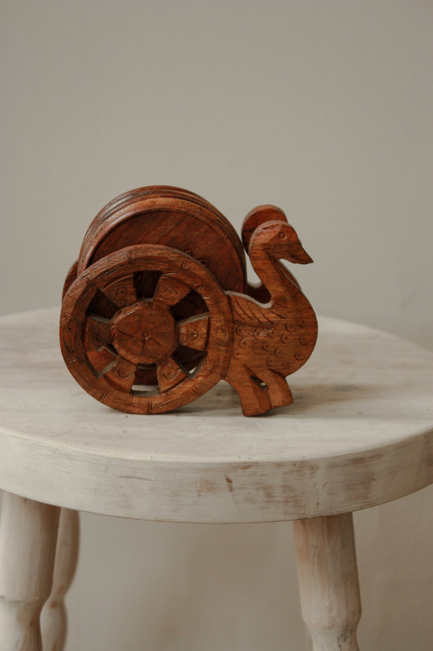 Vintage coaster set with hand carved peacock stand