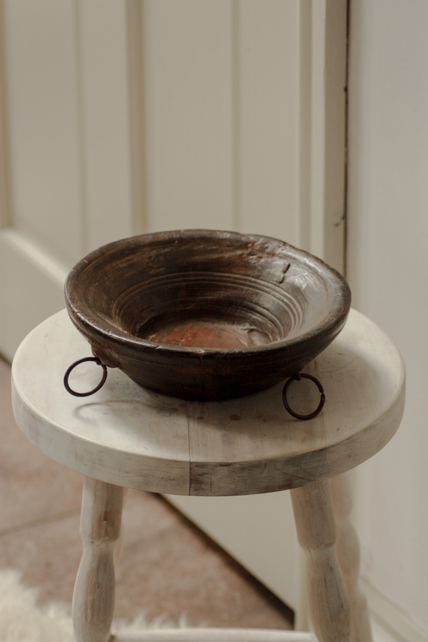 Vintage wooden bowl with metal rings