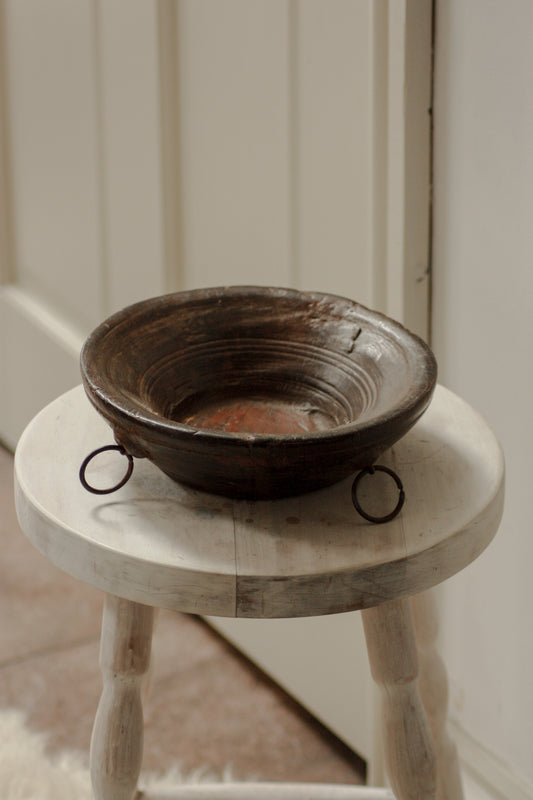 Vintage wooden bowl with metal rings