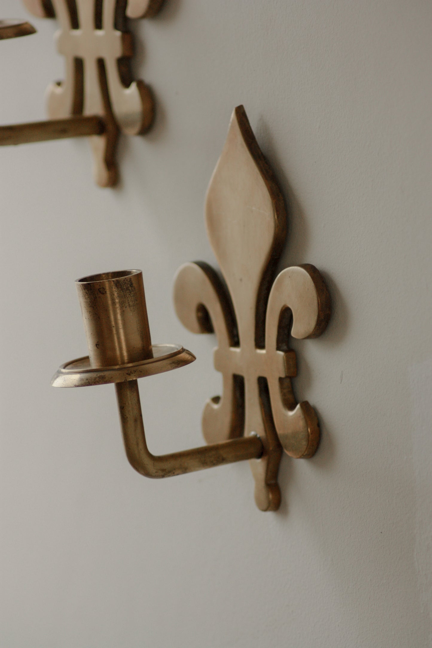 Pair antique brass fleur de lis sconces