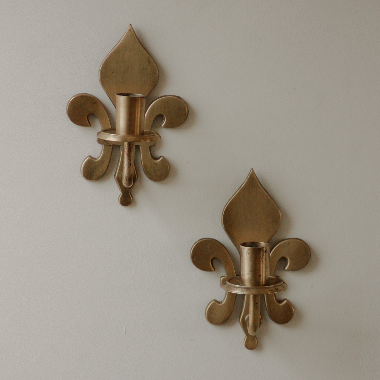 Pair antique brass fleur de lis sconces