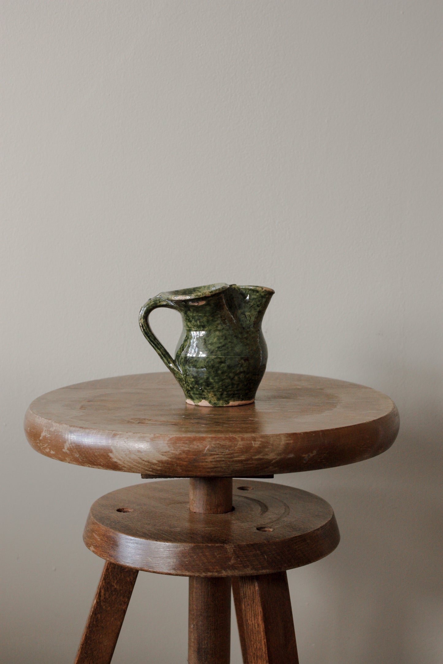 Vintage clay pot with green glaze