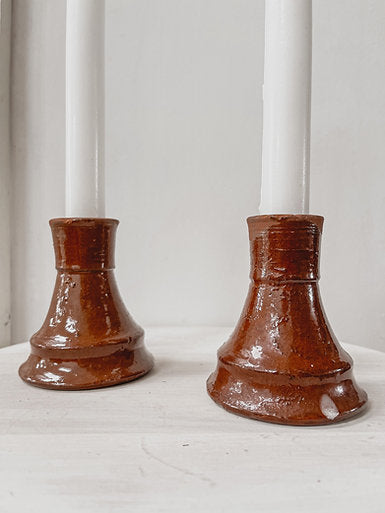 Pair terracotta candleholders