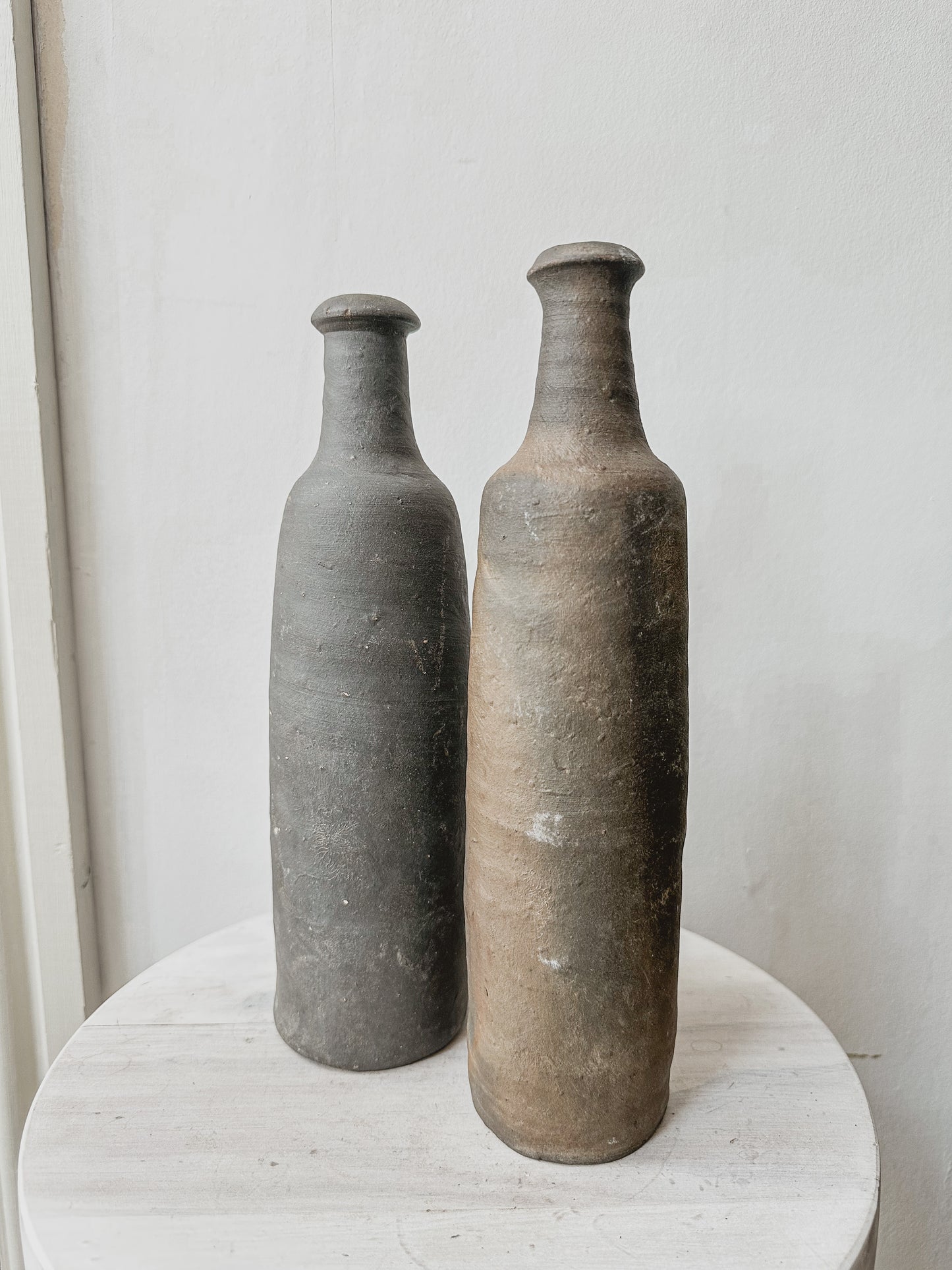 Pair antique french cider bottles