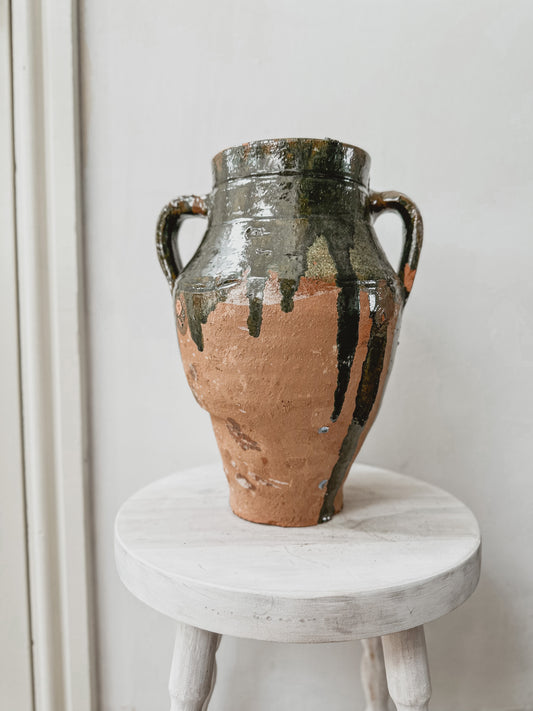 Vintage clay pot with green glaze