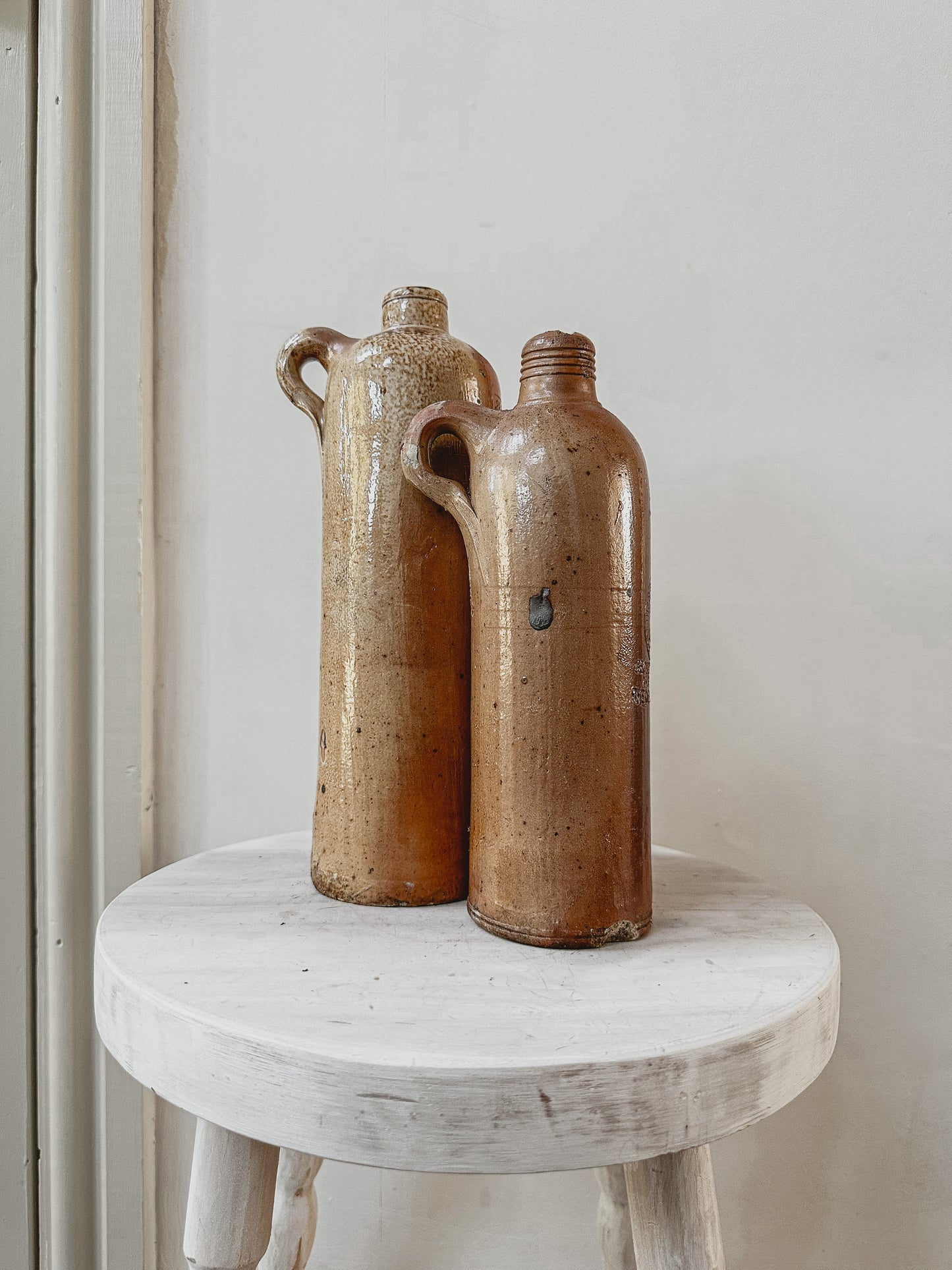 Set of two tall vintage stoneware bottles - set 1