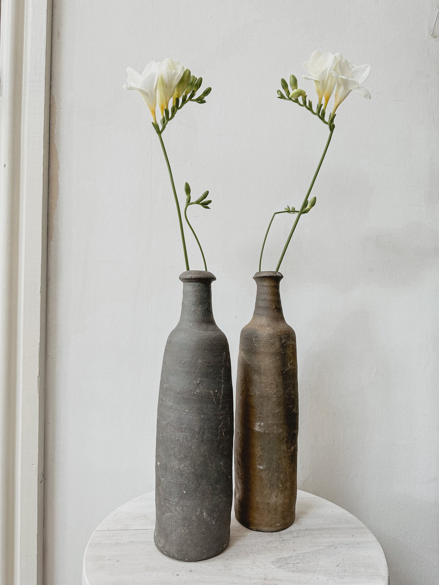 Pair antique french cider bottles