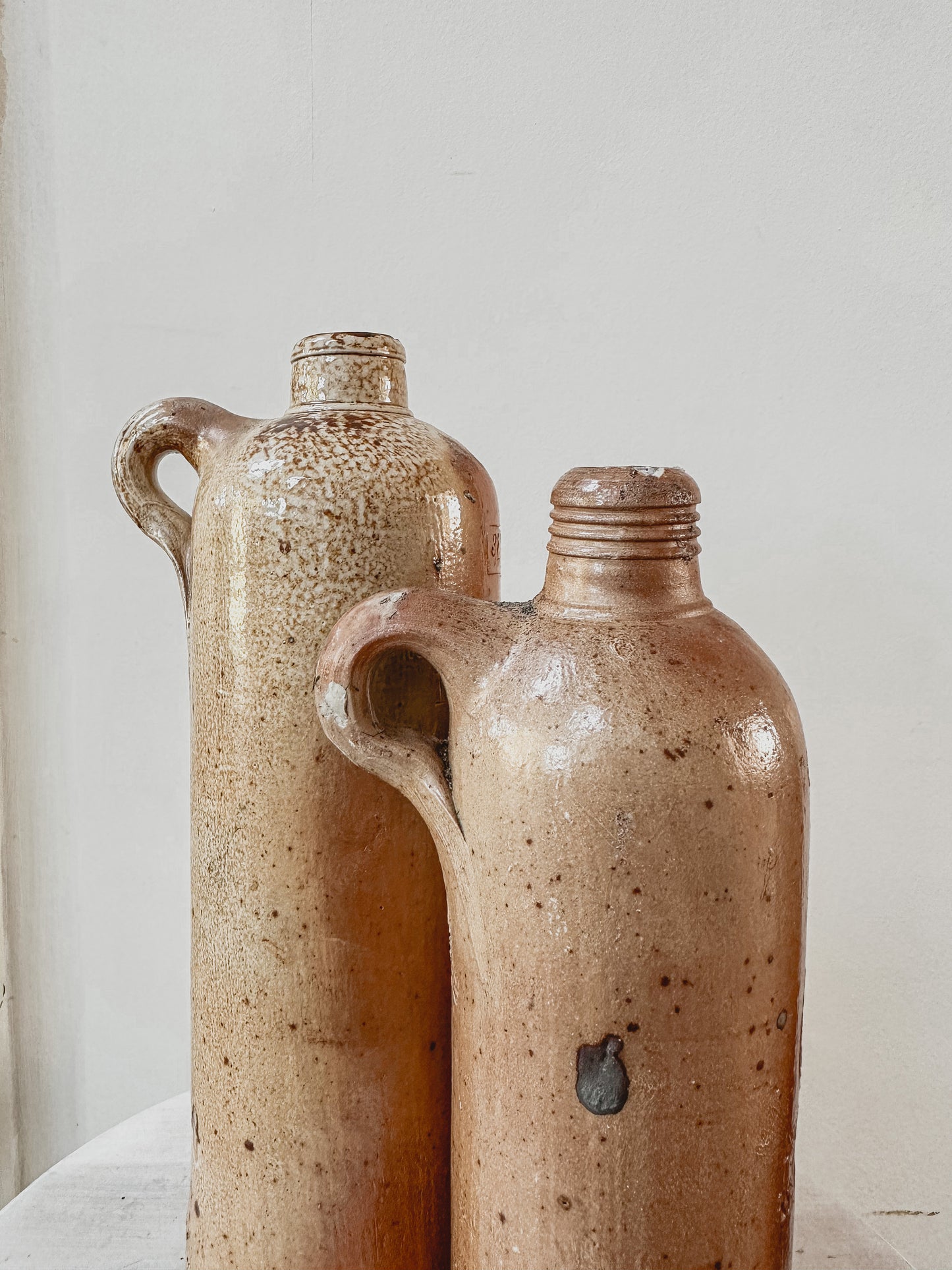 Set of two tall vintage stoneware bottles - set 1