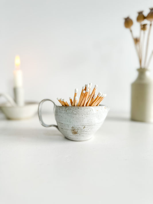 Studio pottery creamer with green glaze