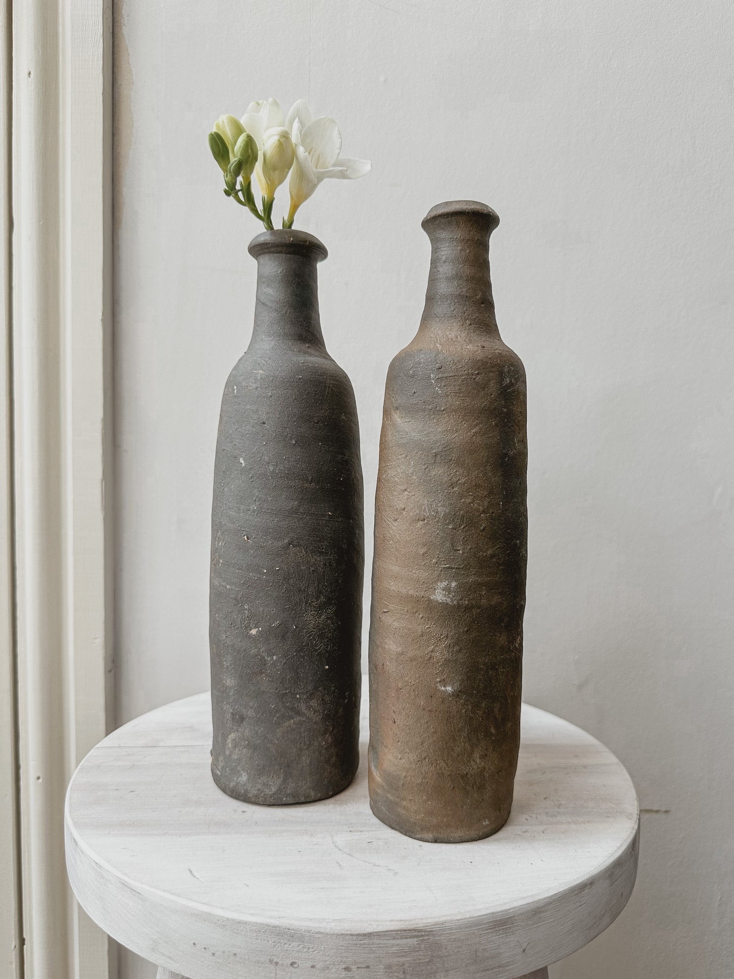 Pair antique french cider bottles